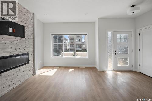 5116 E Simard Avenue, Regina, SK - Indoor Photo Showing Other Room With Fireplace