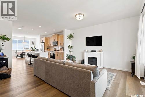 3089 Brighton Common, Saskatoon, SK - Indoor Photo Showing Living Room With Fireplace
