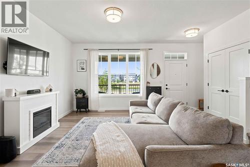 3089 Brighton Common, Saskatoon, SK - Indoor Photo Showing Living Room With Fireplace
