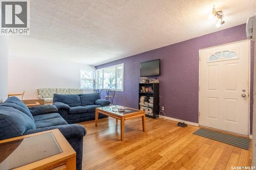 60 Dunning Crescent, Regina, SK - Indoor Photo Showing Living Room With Fireplace
