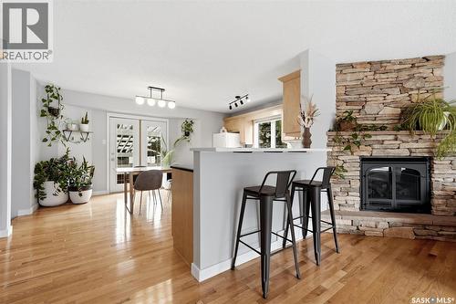 7310 Cribbs Bay, Regina, SK - Indoor Photo Showing Living Room With Fireplace