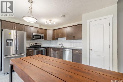 113 1210 Empress Street, Regina, SK - Indoor Photo Showing Kitchen With Double Sink