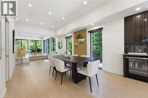 Open-concept dining area with light wood-finish flooring and recessed lighting - 282 Robina Road, Ancaster, ON - Indoor Photo Showing Dining Room