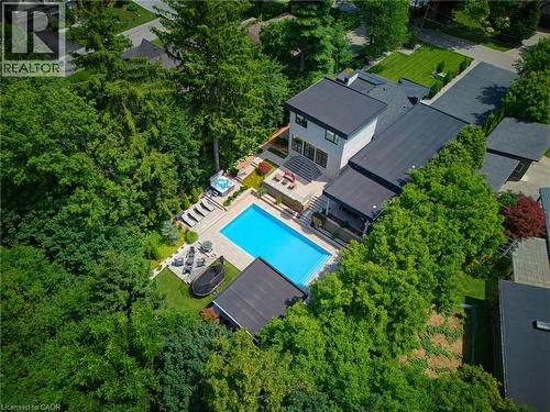 Modern residence featuring an extensive outdoor living area - 282 Robina Road, Ancaster, ON - Outdoor With In Ground Pool