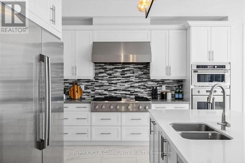 19 Redmond Crescent, Springwater, ON - Indoor Photo Showing Kitchen With Double Sink With Upgraded Kitchen