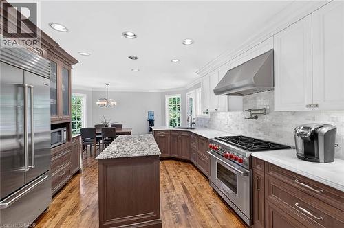 Gourmet kitchen featuring a center island, stainless steel appliances, wood-finish flooring, white countertops, and recessed lighting - 11 Christman Court, Markham, ON - Indoor Photo Showing Kitchen With Upgraded Kitchen