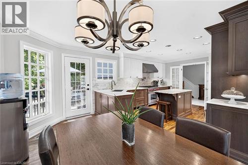 Gourmet kitchen featuring a central island, stainless steel appliances, custom cabinetry, and recessed lighting - 11 Christman Court, Markham, ON - Indoor