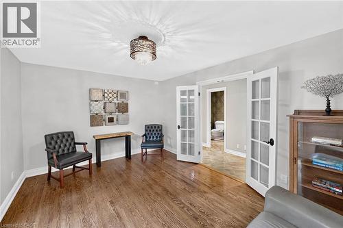 Hardwood-finish flooring, French doors with glass panels, recessed lighting, and a contemporary ceiling fixture - 11 Christman Court, Markham, ON - Indoor