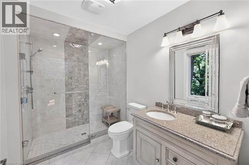 Glass-enclosed shower with tile surround and mosaic accent - 11 Christman Court, Markham, ON - Indoor Photo Showing Bathroom