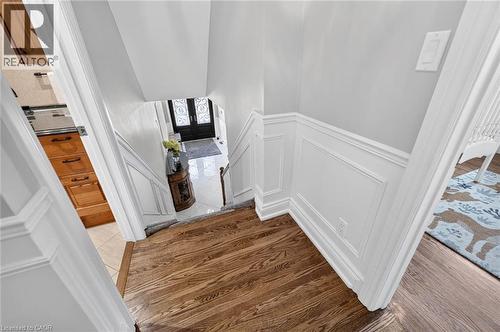 Hardwood flooring, wainscoting, light gray wall paint, and white trim - 11 Christman Court, Markham, ON - Indoor Photo Showing Other Room