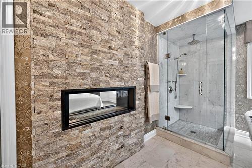 Stone-clad wall featuring a linear fireplace - 11 Christman Court, Markham, ON - Indoor With Fireplace