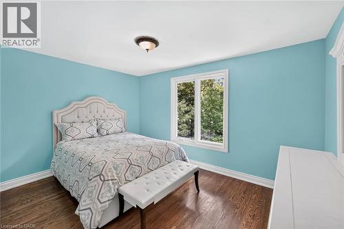 Hardwood flooring, painted walls, white trim, white window frames, and a flush mount light fixture - 11 Christman Court, Markham, ON - Indoor Photo Showing Bedroom