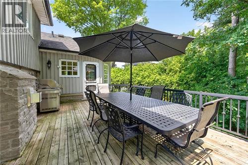 Expansive wood deck with a stone-clad outdoor cooking area and a metal railing system - 11 Christman Court, Markham, ON - Outdoor With Deck Patio Veranda With Exterior