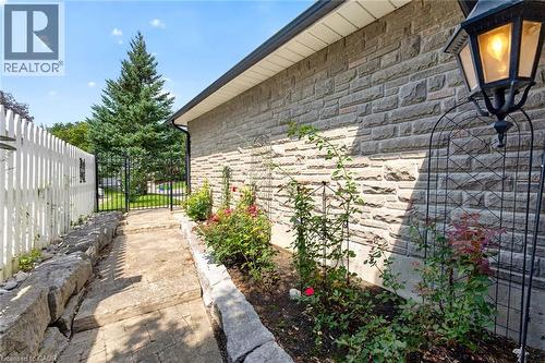 Stone veneer exterior with a decorative wall-mounted lantern - 11 Christman Court, Markham, ON - Outdoor