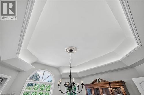 Tray ceiling with integrated lighting, a decorative medallion, and a six-light chandelier - 11 Christman Court, Markham, ON - Indoor Photo Showing Other Room