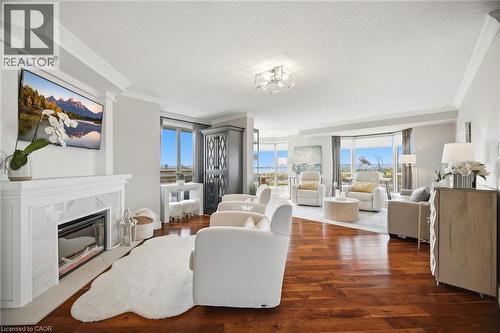 1201 North Shore Boulevard E Unit# 1001, Burlington, ON - Indoor Photo Showing Living Room With Fireplace