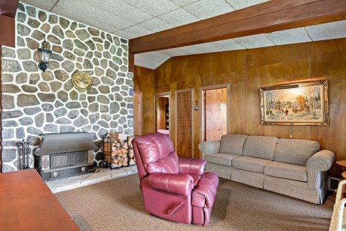 Salon - 188 Ch. White, Harrington, QC - Indoor Photo Showing Living Room With Fireplace