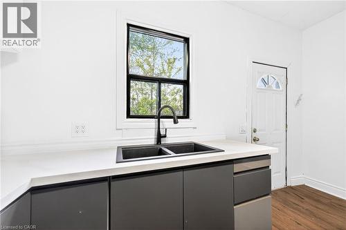 99 Leeming Street, Hamilton, ON - Indoor Photo Showing Kitchen With Double Sink