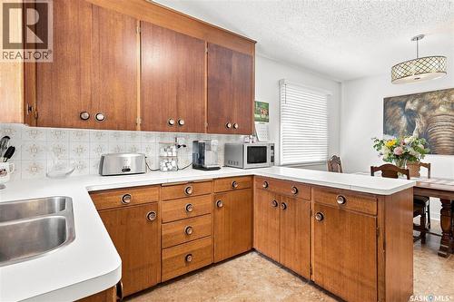 301 Cascade Street, Saskatoon, SK - Indoor Photo Showing Kitchen With Double Sink