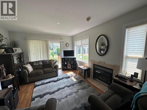 7186 Wright Way, Trail, BC - Indoor Photo Showing Living Room With Fireplace