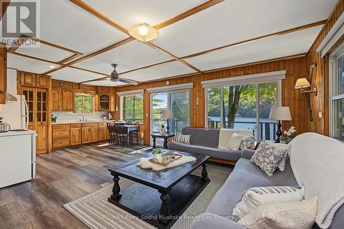 Open living, dining & kitchen areas w lake views - 4 Post Lane, Seguin, ON - Indoor Photo Showing Living Room