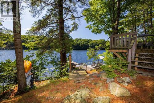 Nestled amongst the pines & natural rock landscape - 4 Post Lane, Seguin, ON - Outdoor With Body Of Water