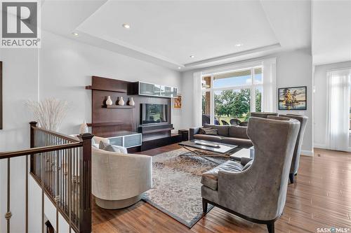 102 602 Cartwright Street, Saskatoon, SK - Indoor Photo Showing Living Room With Fireplace