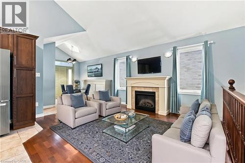 This photo is Staged - 11 Lockwood Street, Cambridge, ON - Indoor Photo Showing Living Room With Fireplace