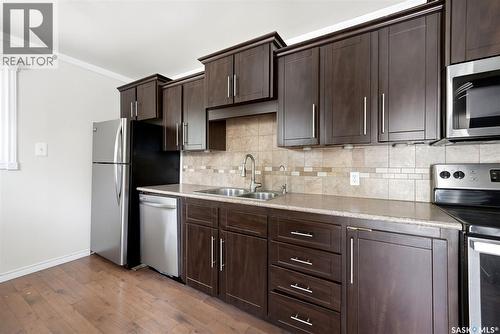 1410 4Th Avenue N, Regina, SK - Indoor Photo Showing Kitchen With Stainless Steel Kitchen With Double Sink
