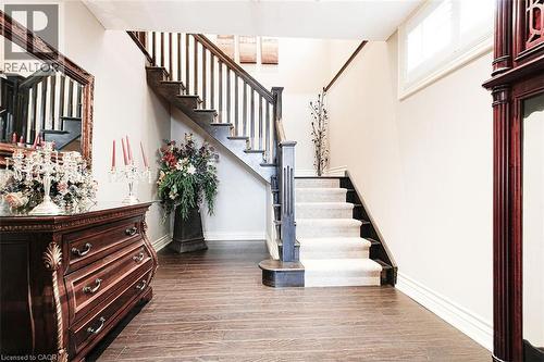 Stairs featuring wood finished floors and baseboards - 205 Paige Place, Kitchener, ON 