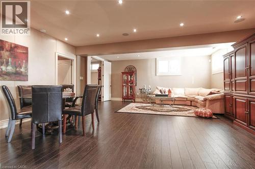 Living room featuring recessed lighting and dark wood-type flooring - 205 Paige Place, Kitchener, ON 