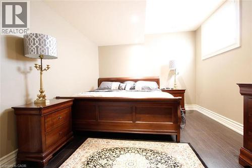 Bedroom with baseboards and dark wood-type flooring - 205 Paige Place, Kitchener, ON 