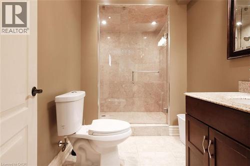 Bathroom featuring vanity, a stall shower, light tile patterned floors, and recessed lighting - 205 Paige Place, Kitchener, ON 