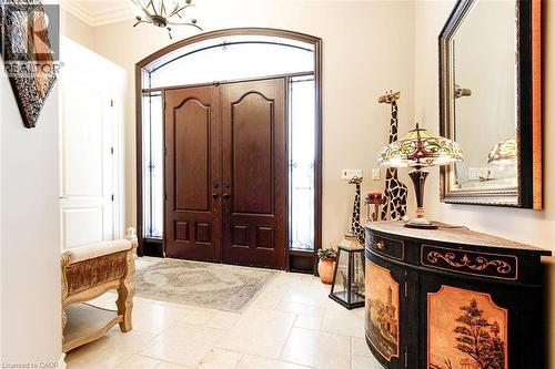 Foyer featuring healthy amount of natural light and ornamental molding - 205 Paige Place, Kitchener, ON 