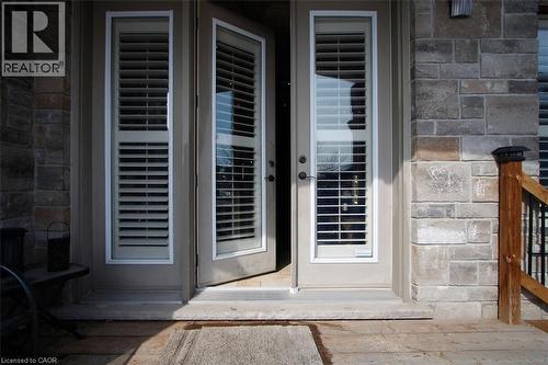 Doorway to property with stone siding - 205 Paige Place, Kitchener, ON 