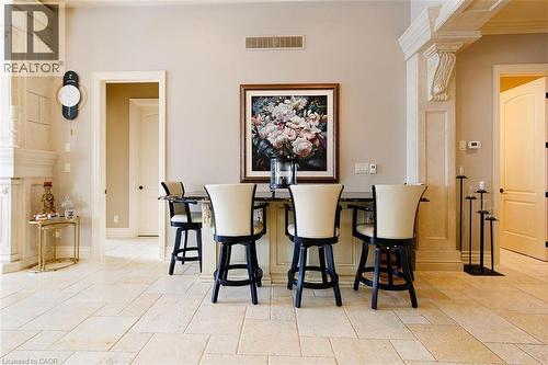 Dining area with ornate columns and baseboards - 205 Paige Place, Kitchener, ON 
