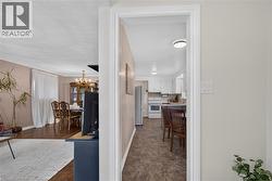 Foyer looking into kitchen & living/dining area - 