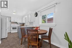 Large kitchen with breakfast area and windows - 