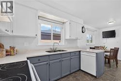 Large kitchen with plenty of storage and windows - 