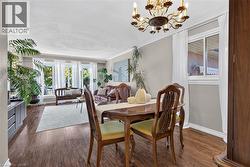 Dining and living area with large window facing front - 