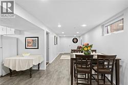 Recessed lighting illuminates the lower-level kitchen, eat-in space, and living/sitting area - 