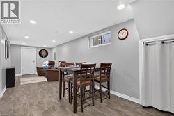 Recessed lighting illuminates the lower-level kitchen, eat-in space, and living/sitting area - 