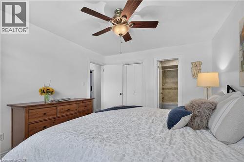 Bright primary bedroom featuring soft natural light, ceiling fan and access to semi-ensuite - 1083 Melton Drive, Mississauga, ON 