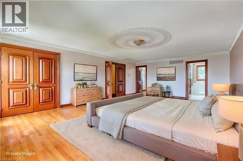 Hardwood flooring, double panel doors, crown molding, and a decorative ceiling medallion with a light fixture - 23 Susan Drive, Hamilton, ON 
