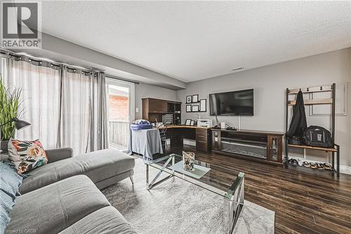Wood-finish flooring throughout, sliding glass door access to a deck, and recessed lighting - 266 Limeridge Road E Unit# 3, Hamilton, ON 