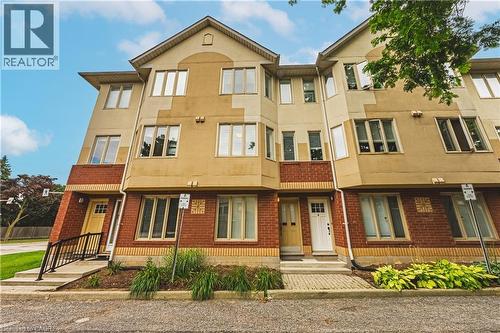 Contemporary townhome exterior featuring a combination of brick and stucco siding - 266 Limeridge Road E Unit# 3, Hamilton, ON 