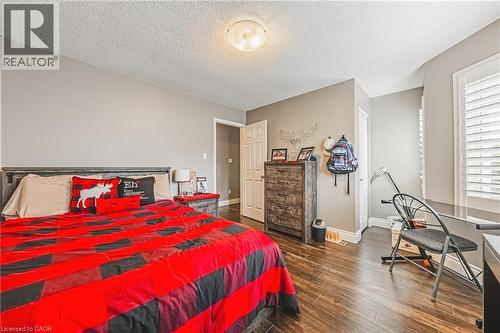 Wood-finish flooring with neutral wall paint and white trim - 266 Limeridge Road E Unit# 3, Hamilton, ON 