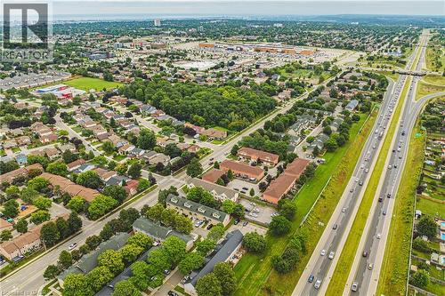 Residential neighborhood with mature trees, commercial establishments, and a multi-lane highway - 266 Limeridge Road E Unit# 3, Hamilton, ON 