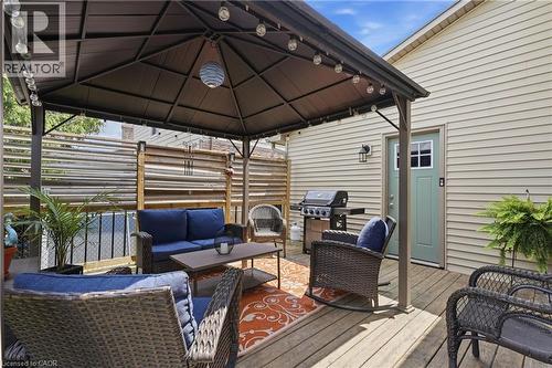 Outdoor patio featuring a dark-toned gazebo with integrated string lighting - 72 Crestlynn Crescent, Simcoe, ON 