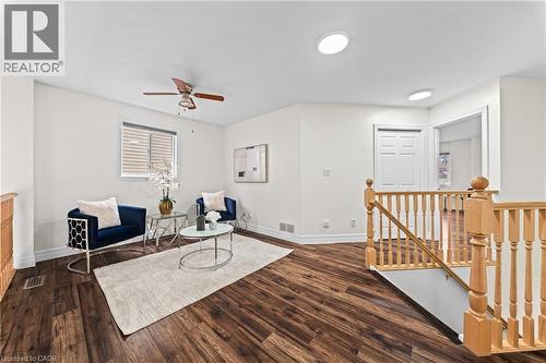 Wood-finish flooring, white walls, and a ceiling fan with integrated lighting - 495 Brigantine Drive, Waterloo, ON 